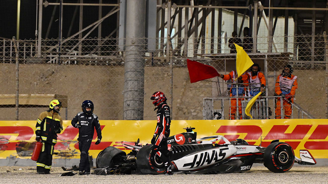 BAHRAIN, BAHRAIN - APRIL 12: Marshals assist Esteban Ocon of France and Haas F1 after a crash during qualifying ahead of the F1 Grand Prix of Bahrain at Bahrain International Circuit on April 12, 2025 in Bahrain, Bahrain. (Photo by Mark Sutton - Formula 1/Formula 1 via Getty Images)