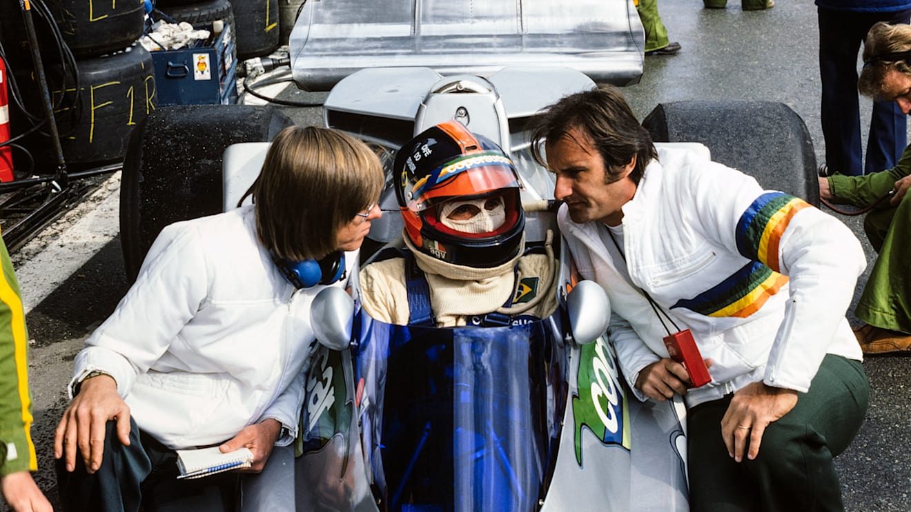Fittipaldi in the family Copersucar-sponsored car with brother Wilson (right) watching on