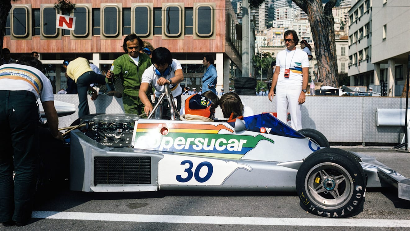 Fittipaldi in the family Copersucar-sponsored car with brother Wilson (right) watching on