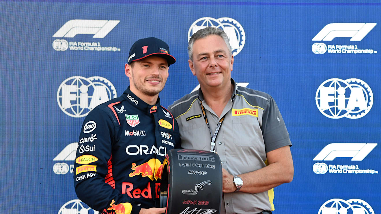 SUZUKA, JAPAN - SEPTEMBER 23: Pole man Max Verstappen, Red Bull Racing, receives his Pirelli Pole Position Award from Mario Isola, Racing Manager, Pirelli Motorsport during the Japanese GP at Suzuka on Saturday September 23, 2023 in Suzuka, Japan. (Photo by Mark Sutton / LAT Images)