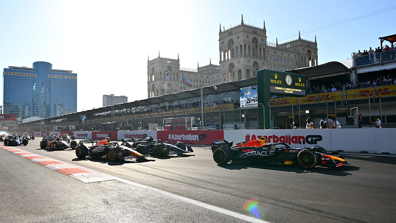 BAKU, AZERBAIJAN - APRIL 29: Sergio Perez of Mexico driving the (11) Oracle Red Bull Racing RB19 leads Max Verstappen of the Netherlands driving the (1) Oracle Red Bull Racing RB19 and George Russell of Great Britain driving the (63) Mercedes AMG Petronas F1 Team W14 on track during the Sprint ahead of the F1 Grand Prix of Azerbaijan at Baku City Circuit on April 29, 2023 in Baku, Azerbaijan. (Photo by Dan Mullan - Formula 1/Formula 1 via Getty Images)