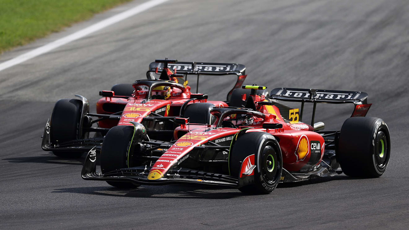 MONZA, ITALY - SEPTEMBER 03: Carlos Sainz of Spain driving (55) the Ferrari SF-23 leads Charles Leclerc of Monaco driving the (16) Ferrari SF-23 during the F1 Grand Prix of Italy at Autodromo Nazionale Monza on September 03, 2023 in Monza, Italy. (Photo by Ryan Pierse/Getty Images)
