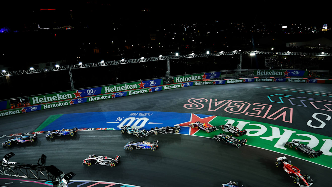 LAS VEGAS, NEVADA - NOVEMBER 18: Fernando Alonso of Spain driving the (14) Aston Martin AMR23 Mercedes and Valtteri Bottas of Finland driving the (77) Alfa Romeo F1 C43 Ferrari collide at turn one during the F1 Grand Prix of Las Vegas at Las Vegas Strip Circuit on November 18, 2023 in Las Vegas, Nevada. (Photo by Chris Graythen/Getty Images)