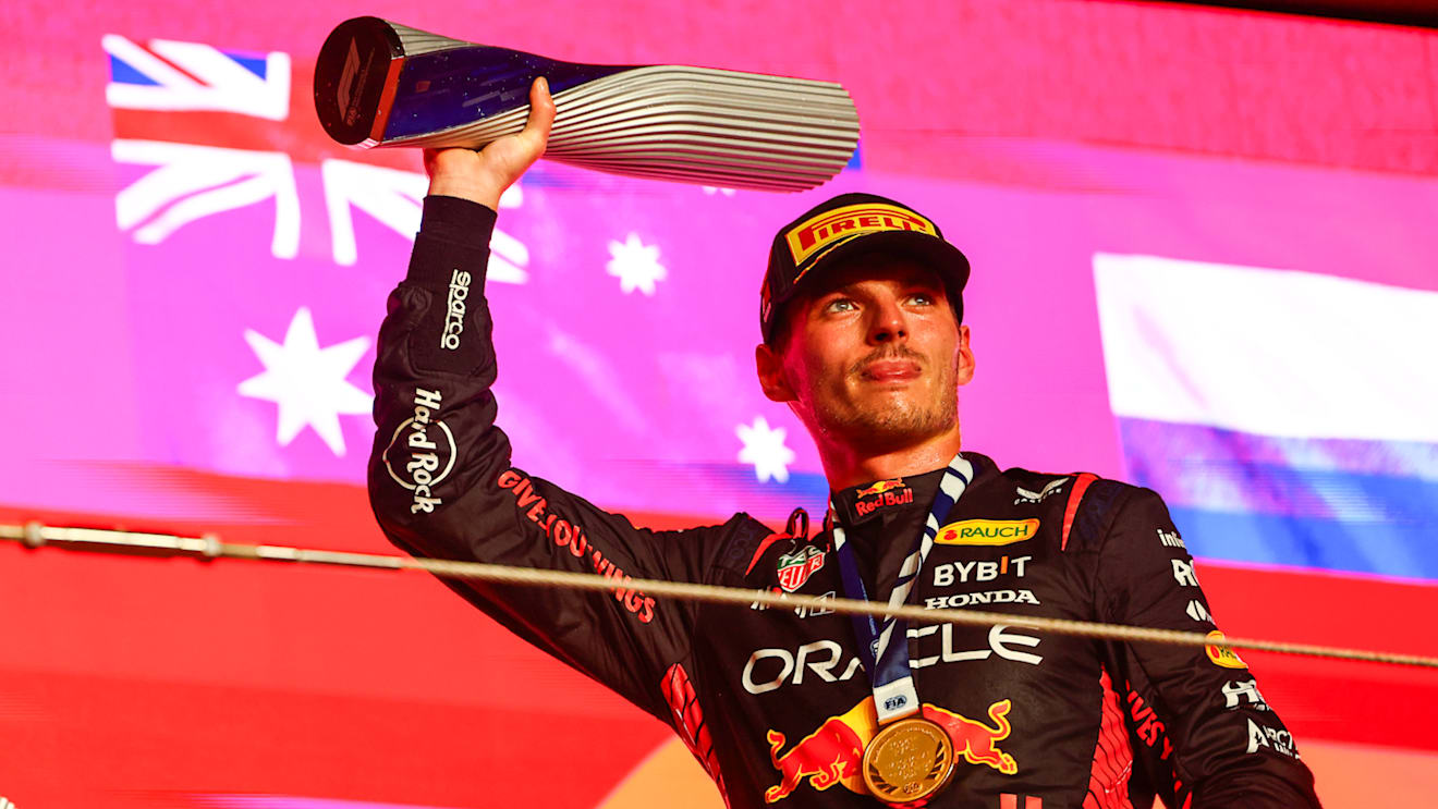 LUSAIL CITY, QATAR - OCTOBER 08: Race winner Max Verstappen of the Netherlands and Oracle Red Bull Racing celebrates on the podium during the F1 Grand Prix of Qatar at Lusail International Circuit on October 08, 2023 in Lusail City, Qatar. (Photo by Mark Thompson/Getty Images)