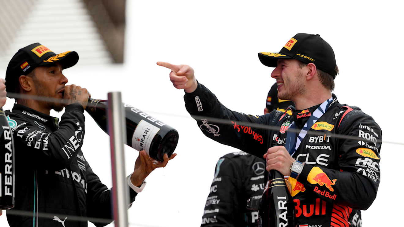 BARCELONA, SPAIN - JUNE 04: Race Winner Max Verstappen of the Netherlands and Oracle Red Bull Racing and Second placed Lewis Hamilton of Great Britain and Mercedes celebrate on the podium during the F1 Grand Prix of Spain at Circuit de Barcelona-Catalunya on June 04, 2023 in Barcelona, Spain. (Photo by David Ramos/Getty Images)