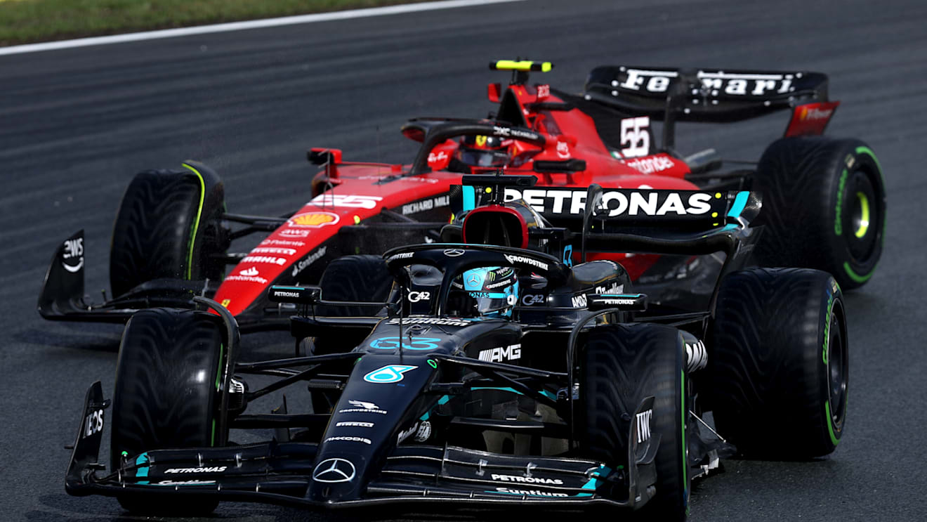 ZANDVOORT, NETHERLANDS - AUGUST 26: George Russell of Great Britain driving the (63) Mercedes AMG Petronas F1 Team W14 leads Carlos Sainz of Spain driving (55) the Ferrari SF-23 on track during qualifying ahead of the F1 Grand Prix of The Netherlands at Circuit Zandvoort on August 26, 2023 in Zandvoort, Netherlands. (Photo by Lars Baron/Getty Images)