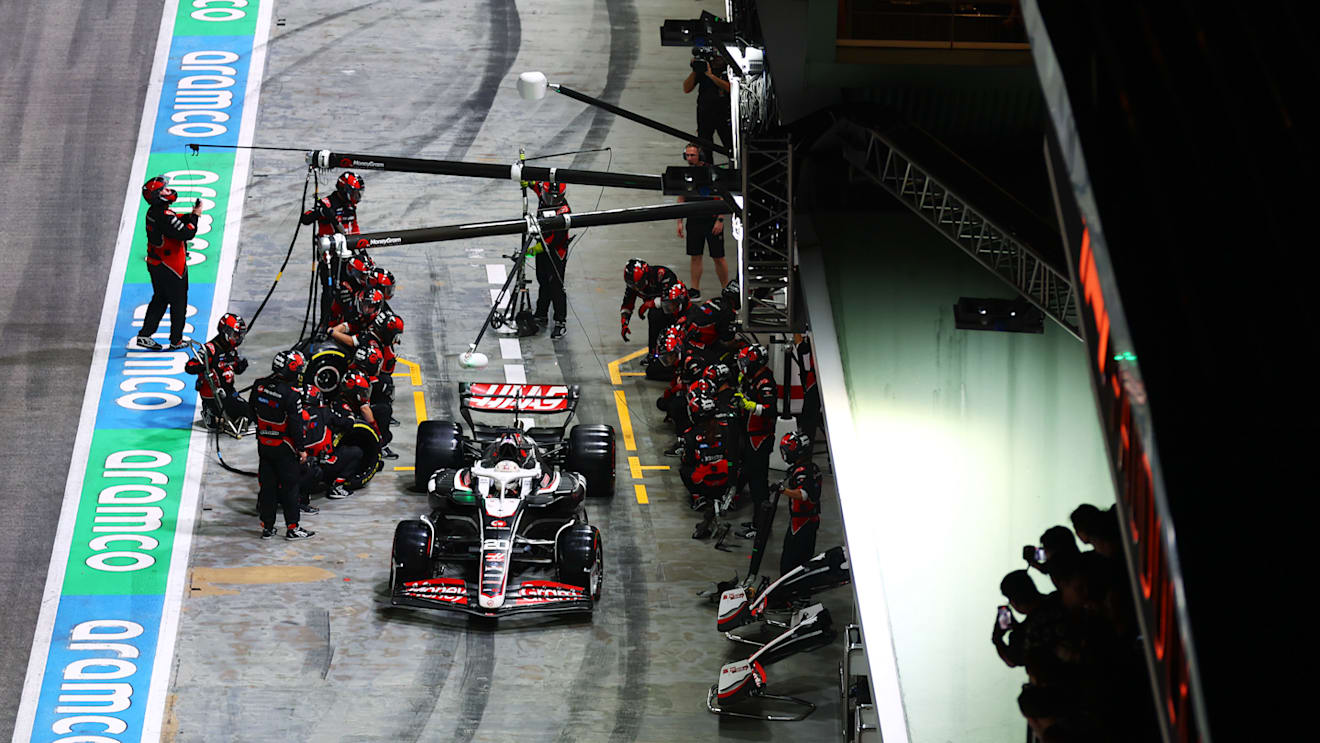 SINGAPORE, SINGAPORE - SEPTEMBER 22: Kevin Magnussen of Denmark driving the (20) Haas F1 VF-24 Ferrari makes a pit stop during the F1 Grand Prix of Singapore at Marina Bay Street Circuit on September 22, 2024 in Singapore, Singapore. (Photo by Lars Baron - Formula 1/Formula 1 via Getty Images)