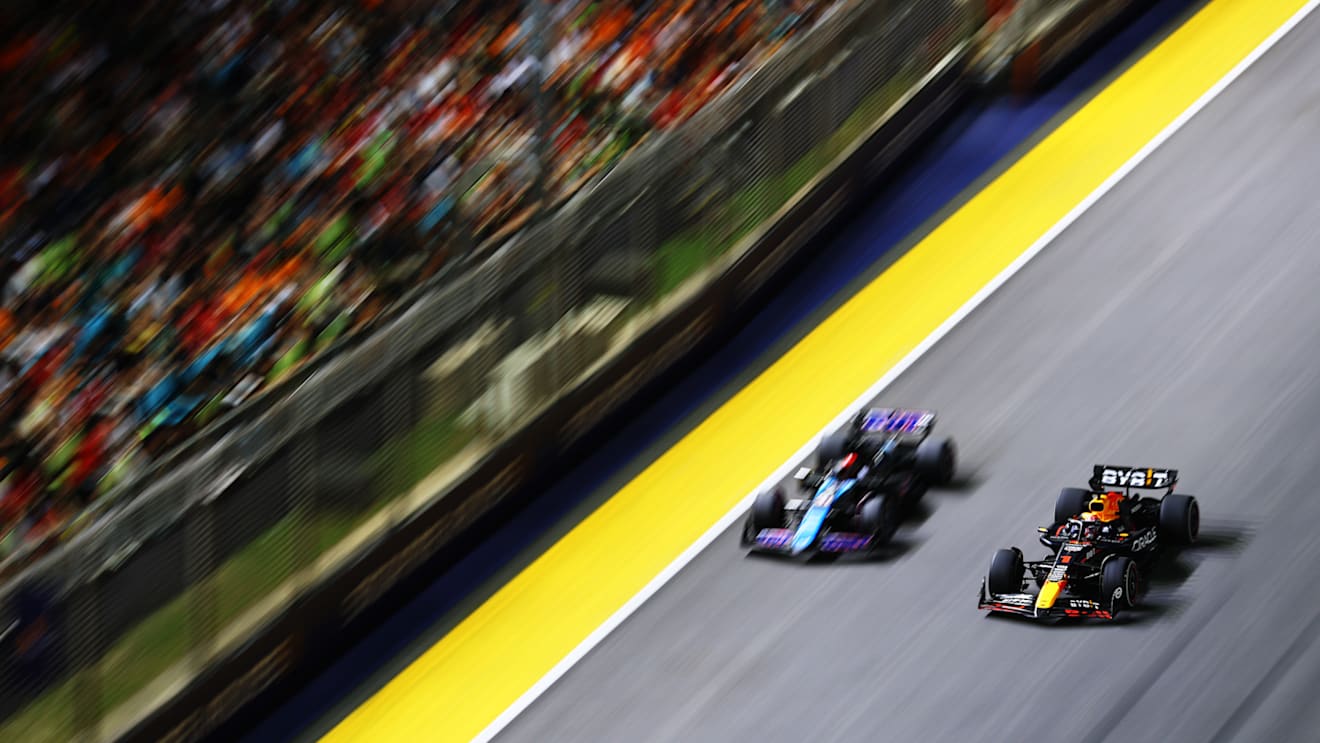 SINGAPORE, SINGAPORE - SEPTEMBER 22: Max Verstappen of the Netherlands driving the (1) Oracle Red Bull Racing RB20 overtakes Pierre Gasly of France driving the (10) Alpine F1 A524 Renault on track during the F1 Grand Prix of Singapore at Marina Bay Street Circuit on September 22, 2024 in Singapore, Singapore. (Photo by Lars Baron - Formula 1/Formula 1 via Getty Images)