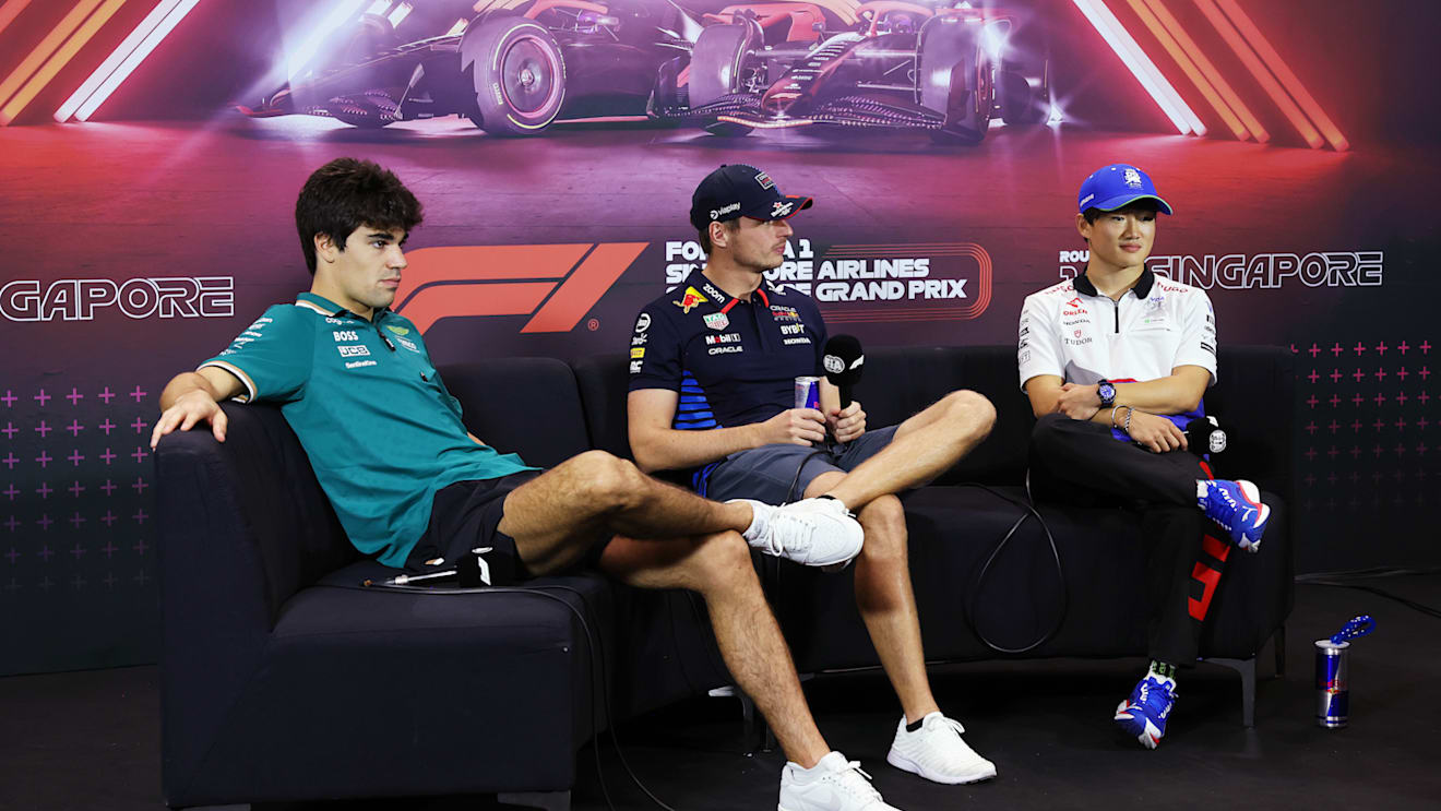 SINGAPORE, SINGAPORE - SEPTEMBER 19: Lance Stroll of Canada and Aston Martin F1 Team, Max Verstappen of the Netherlands and Oracle Red Bull Racing and Yuki Tsunoda of Japan and Visa Cash App RB attend the Drivers Press Conference during previews ahead of the F1 Grand Prix of Singapore at Marina Bay Street Circuit on September 19, 2024 in Singapore, Singapore. (Photo by Lars Baron/Getty Images)