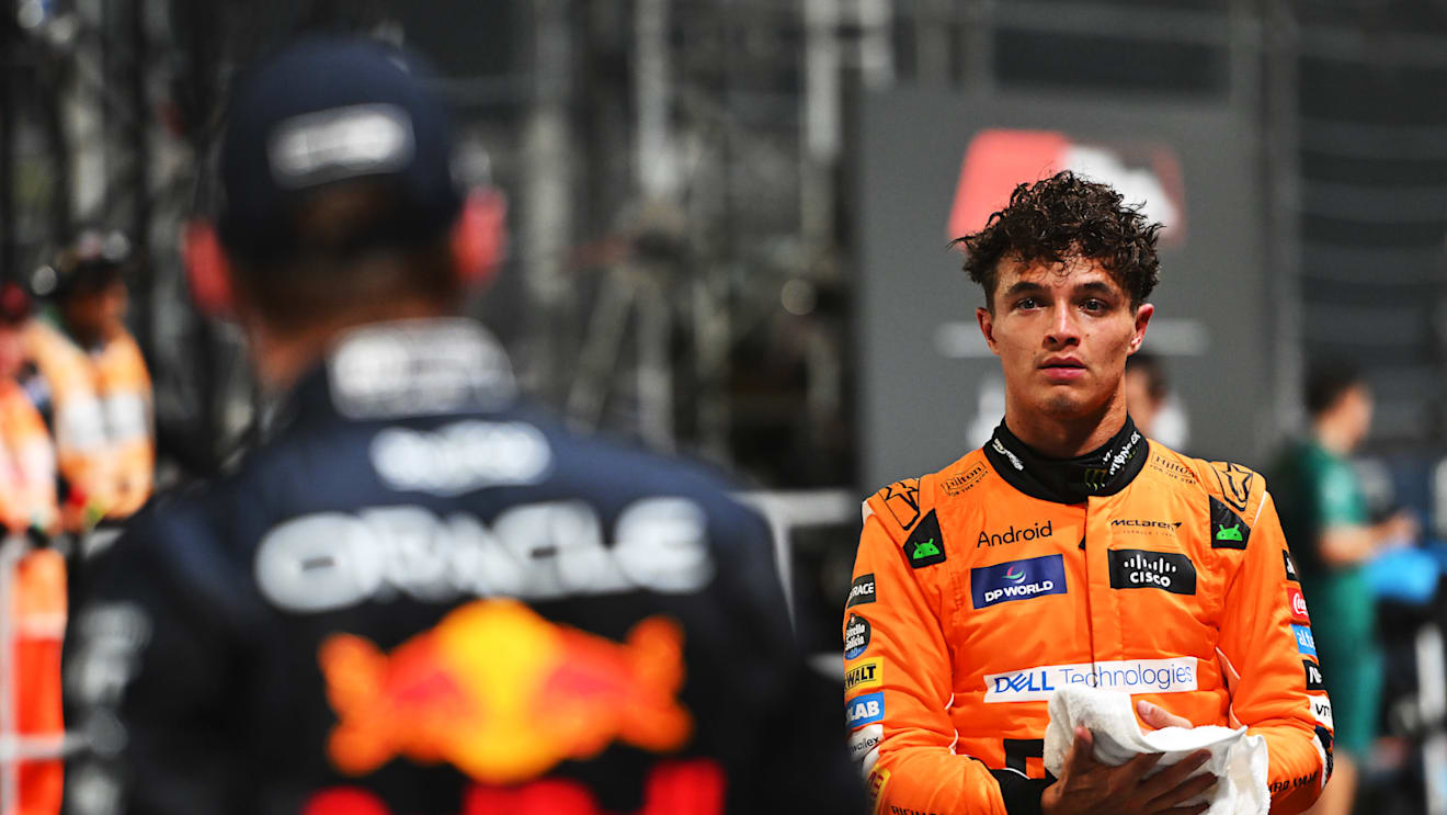 SINGAPORE, SINGAPORE - SEPTEMBER 21: Pole position qualifier Lando Norris of Great Britain and McLaren talks with Second placed qualifier Max Verstappen of the Netherlands and Oracle Red Bull Racing in parc ferme during qualifying ahead of the F1 Grand Prix of Singapore at Marina Bay Street Circuit on September 21, 2024 in Singapore, Singapore. (Photo by Rudy Carezzevoli/Getty Images)