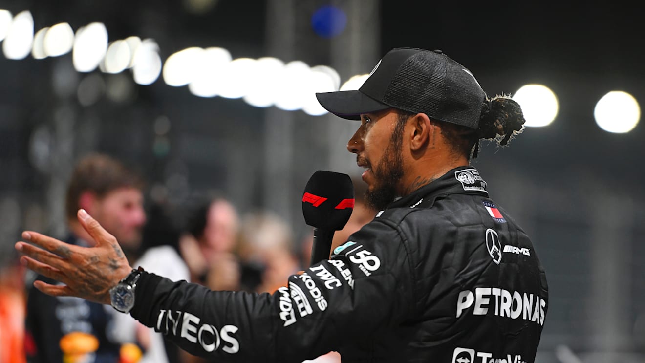 SINGAPORE, SINGAPORE - SEPTEMBER 21: Third placed qualifier Lewis Hamilton of Great Britain and Mercedes talks to the media in parc ferme during qualifying ahead of the F1 Grand Prix of Singapore at Marina Bay Street Circuit on September 21, 2024 in Singapore, Singapore. (Photo by Rudy Carezzevoli/Getty Images)