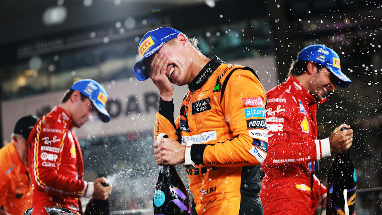 ABU DHABI, UNITED ARAB EMIRATES - DECEMBER 08: Race winner Lando Norris of Great Britain and McLaren celebrates on the podium during the F1 Grand Prix of Abu Dhabi at Yas Marina Circuit on December 08, 2024 in Abu Dhabi, United Arab Emirates. (Photo by Bryn Lennon - Formula 1/Formula 1 via Getty Images)