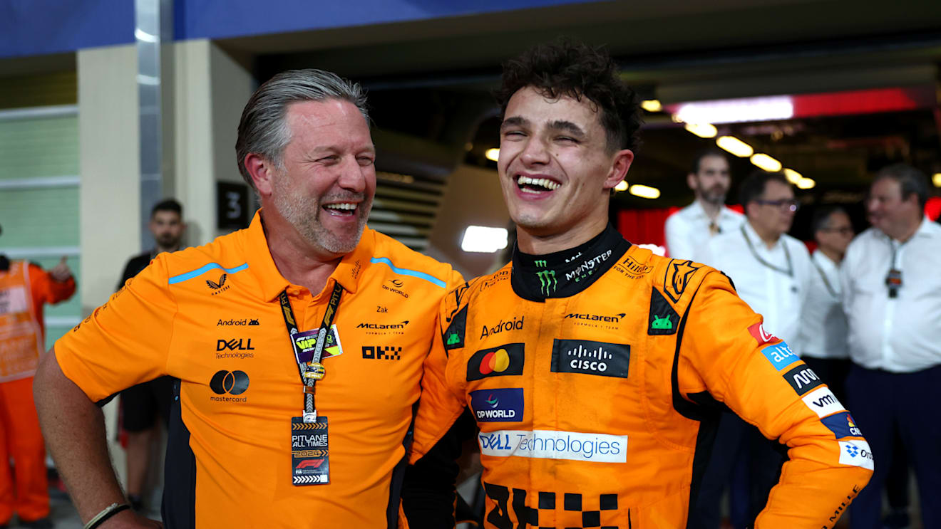 ABU DHABI, UNITED ARAB EMIRATES - DECEMBER 08: Race winner Lando Norris of Great Britain and McLaren and McLaren Chief Executive Officer Zak Brown celebrate in parc ferme after the McLaren team won the 2024 F1 Constructors Championship during the F1 Grand Prix of Abu Dhabi at Yas Marina Circuit on December 08, 2024 in Abu Dhabi, United Arab Emirates. (Photo by Bryn Lennon - Formula 1/Formula 1 via Getty Images)