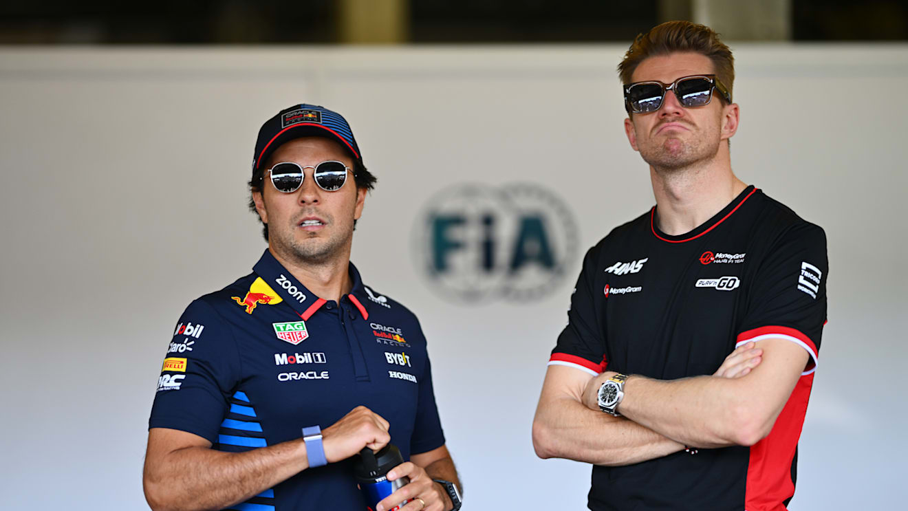 BAKU, AZERBAIJAN - SEPTEMBER 15: Sergio Perez of Mexico and Oracle Red Bull Racing and Nico Hulkenberg of Germany and Haas F1 look on from the FIA garage prior to the F1 Grand Prix of Azerbaijan at Baku City Circuit on September 15, 2024 in Baku, Azerbaijan. (Photo by Dan Mullan/Getty Images)