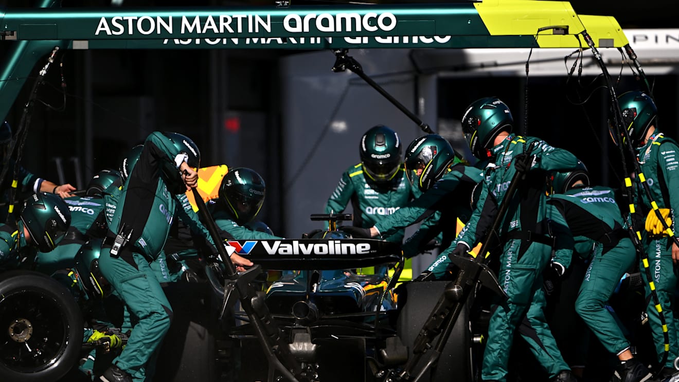 BAKU, AZERBAIJAN - SEPTEMBER 15: Lance Stroll of Canada driving the (18) Aston Martin AMR24 Mercedes makes a pitstop during the F1 Grand Prix of Azerbaijan at Baku City Circuit on September 15, 2024 in Baku, Azerbaijan. (Photo by Dan Mullan/Getty Images)