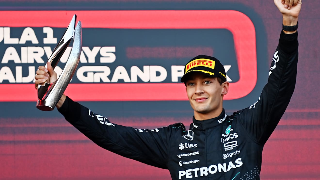BAKU, AZERBAIJAN - SEPTEMBER 15: Third placed George Russell of Great Britain and Mercedes celebrates on the podium during the F1 Grand Prix of Azerbaijan at Baku City Circuit on September 15, 2024 in Baku, Azerbaijan. (Photo by James Sutton/Getty Images)