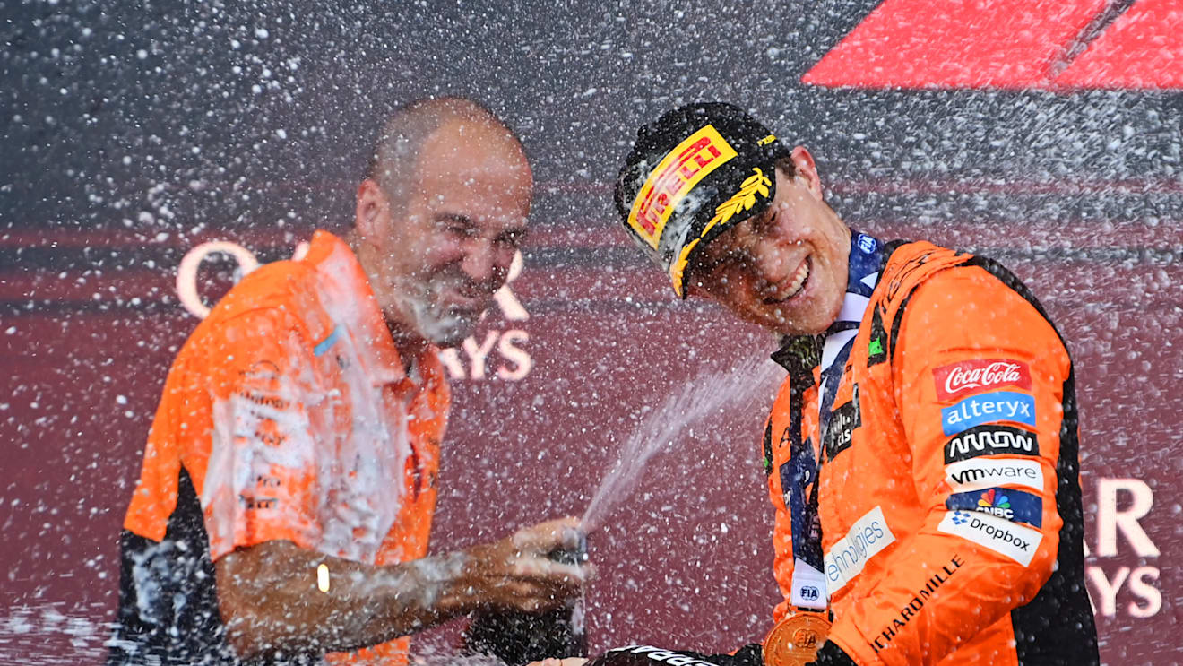 BAKU, AZERBAIJAN - SEPTEMBER 15: Race winner Oscar Piastri of Australia and McLaren and McLaren race engineer Tom Stallard celebrate on the podium during the F1 Grand Prix of Azerbaijan at Baku City Circuit on September 15, 2024 in Baku, Azerbaijan. (Photo by James Sutton/Getty Images)