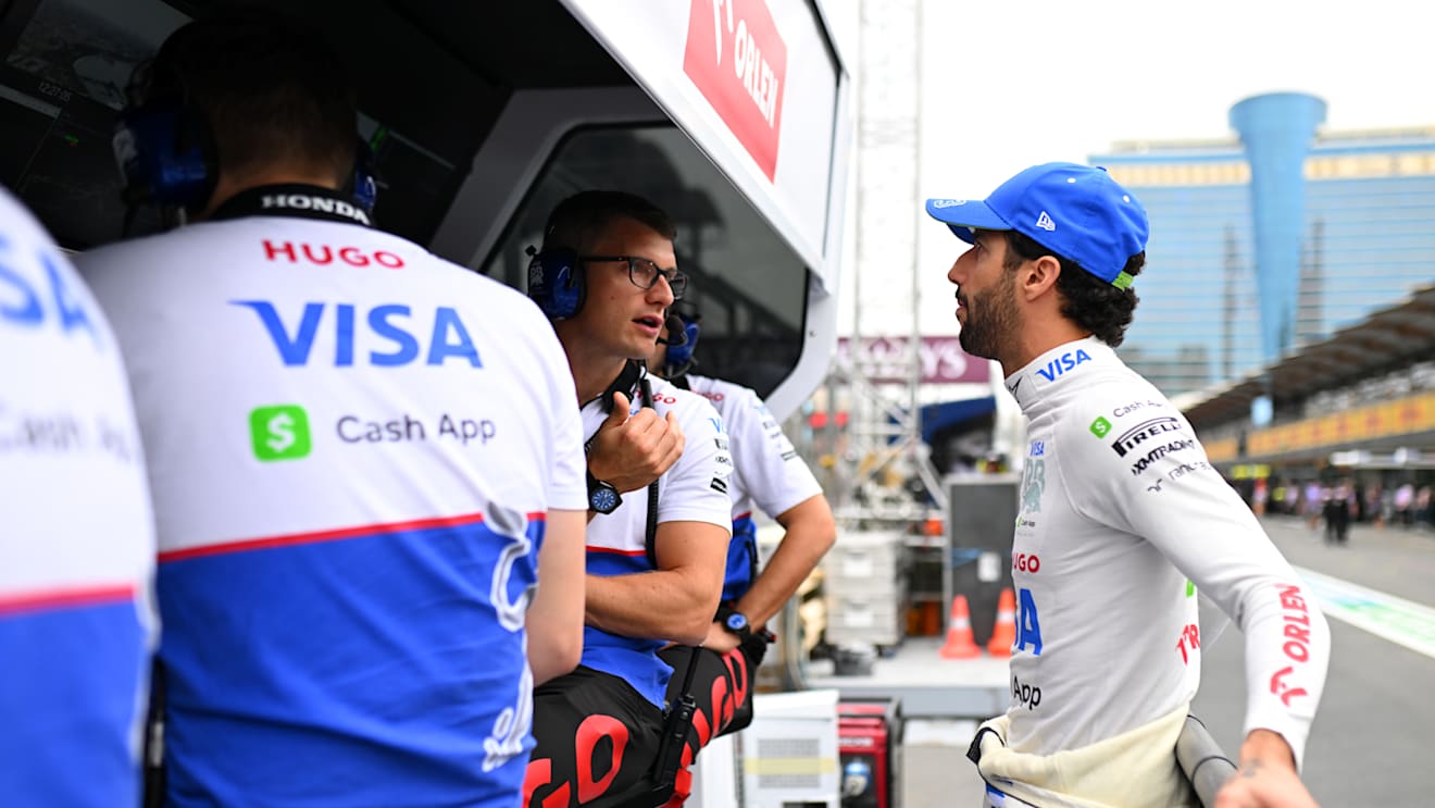 BAKU, AZERBAIJAN - SEPTEMBER 14: Daniel Ricciardo of Australia and Visa Cash App RB talks with race engineer Pierre Hamelin on the pitwall during final practice ahead of the F1 Grand Prix of Azerbaijan at Baku City Circuit on September 14, 2024 in Baku, Azerbaijan. (Photo by Rudy Carezzevoli/Getty Images)