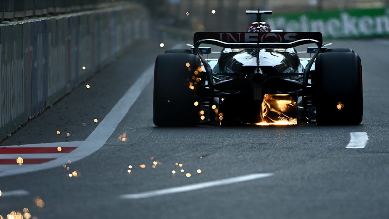 BAKU, AZERBAIJAN - SEPTEMBER 14: Sparks fly behind George Russell of Great Britain driving the (63) Mercedes AMG Petronas F1 Team W15 during qualifying ahead of the F1 Grand Prix of Azerbaijan at Baku City Circuit on September 14, 2024 in Baku, Azerbaijan. (Photo by James Sutton/Getty Images)