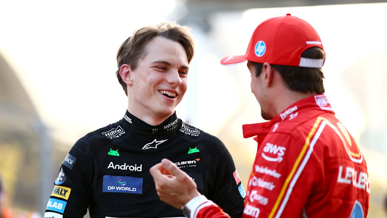 BAKU, AZERBAIJAN - SEPTEMBER 14: Pole position qualifier Charles Leclerc of Monaco and Ferrari talks with Second placed qualifier Oscar Piastri of Australia and McLaren in parc ferme during qualifying ahead of the F1 Grand Prix of Azerbaijan at Baku City Circuit on September 14, 2024 in Baku, Azerbaijan. (Photo by Clive Rose - Formula 1/Formula 1 via Getty Images)