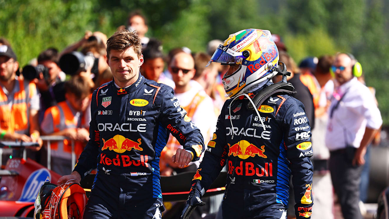 SPA, BELGIUM - JULY 28: 5th placed Max Verstappen of the Netherlands and Oracle Red Bull Racing and 8th placed Sergio Perez of Mexico and Oracle Red Bull Racing talk in parc ferme during the F1 Grand Prix of Belgium at Circuit de Spa-Francorchamps on July 28, 2024 in Spa, Belgium. (Photo by Mark Thompson/Getty Images)