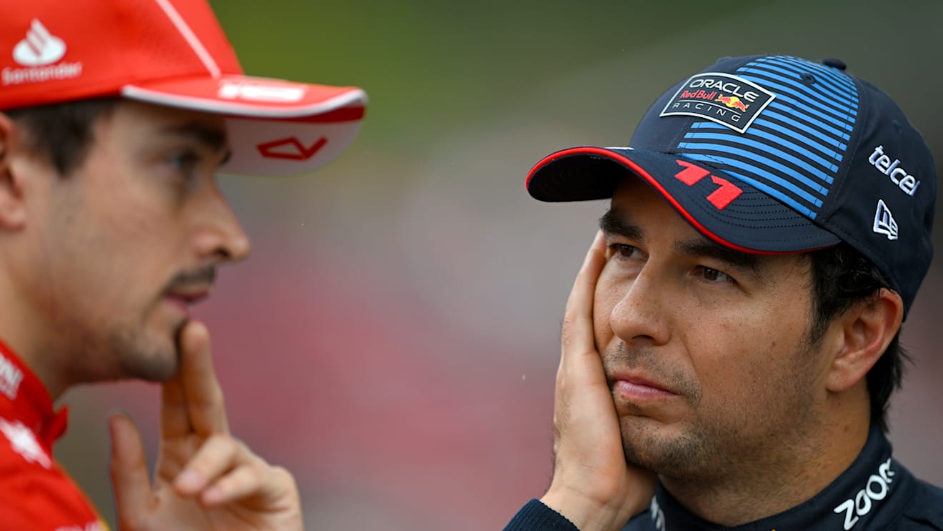 SPA, BELGIUM - JULY 27: Third placed qualifier Sergio Perez of Mexico and Oracle Red Bull Racing and Second placed qualifier Charles Leclerc of Monaco and Ferrari talk in parc ferme during qualifying ahead of the F1 Grand Prix of Belgium at Circuit de Spa-Francorchamps on July 27, 2024 in Spa, Belgium. (Photo by Rudy Carezzevoli/Getty Images)
