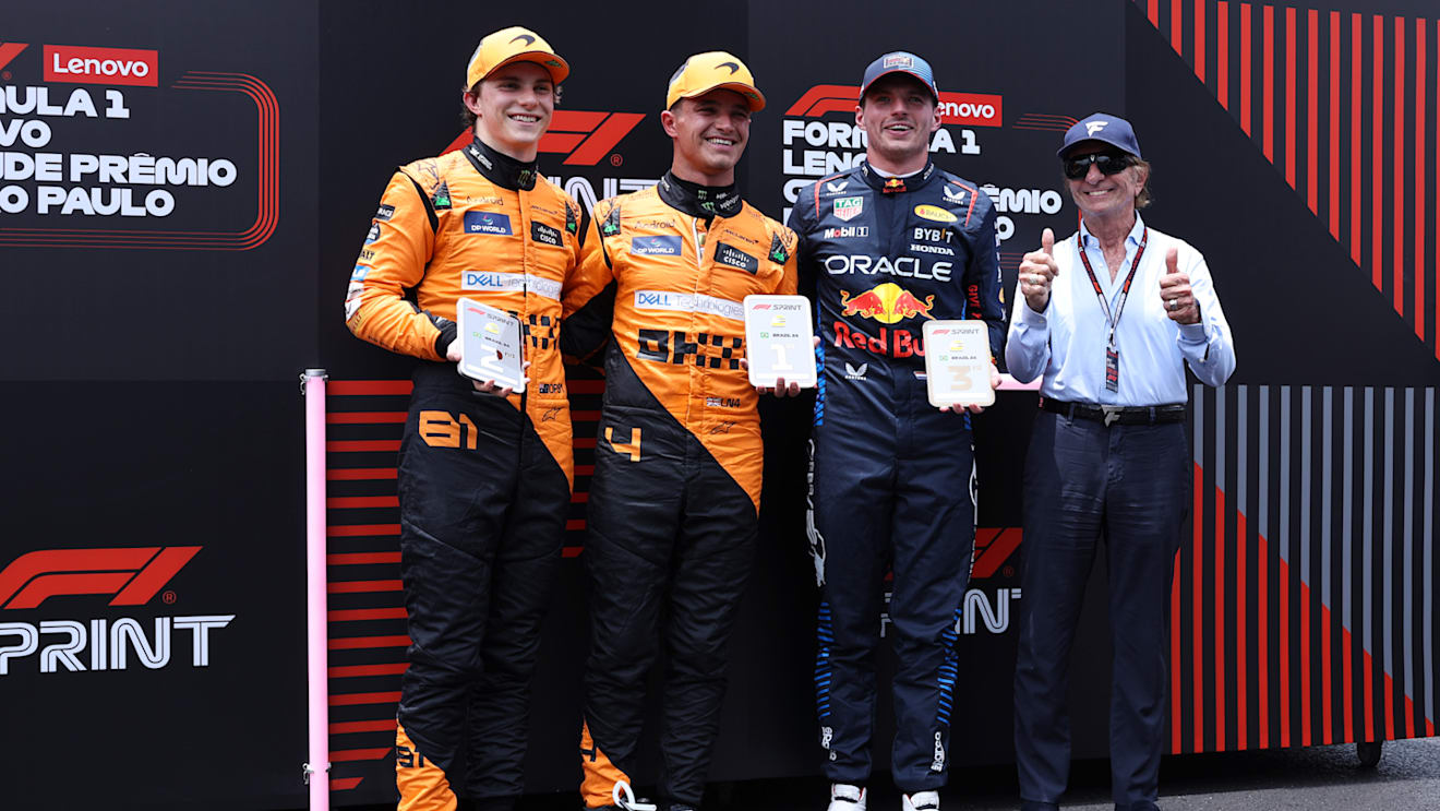 SAO PAULO, BRAZIL - NOVEMBER 02: Sprint winner Lando Norris of Great Britain and McLaren, Second placed Oscar Piastri of Australia and McLaren, Third placed Max Verstappen of the Netherlands and Oracle Red Bull Racing and Emerson Fittipaldi pose for a photo in parc ferme during the Sprint ahead of the F1 Grand Prix of Brazil at Autodromo Jose Carlos Pace on November 02, 2024 in Sao Paulo, Brazil. (Photo by Lars Baron - Formula 1/Formula 1 via Getty Images)