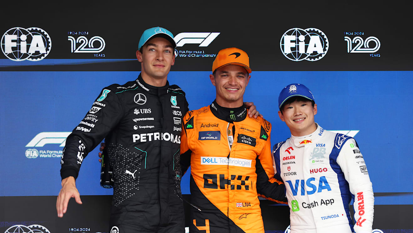 SAO PAULO, BRAZIL - NOVEMBER 03: Pole position qualifier Lando Norris of Great Britain and McLaren, Second placed qualifier George Russell of Great Britain and Mercedes and Third placed qualifier Yuki Tsunoda of Japan and Visa Cash App RB pose for a photo in parc ferme  during qualifying ahead of the F1 Grand Prix of Brazil at Autodromo Jose Carlos Pace on November 03, 2024 in Sao Paulo, Brazil. (Photo by Lars Baron - Formula 1/Formula 1 via Getty Images)
