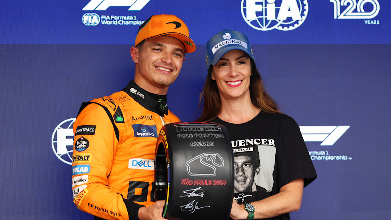 SAO PAULO, BRAZIL - NOVEMBER 03: Pole position qualifier Lando Norris of Great Britain and McLaren is presented with the Pirelli Pole Position award by Bianca Senna in parc ferme during qualifying ahead of the F1 Grand Prix of Brazil at Autodromo Jose Carlos Pace on November 03, 2024 in Sao Paulo, Brazil. (Photo by Lars Baron - Formula 1/Formula 1 via Getty Images)
