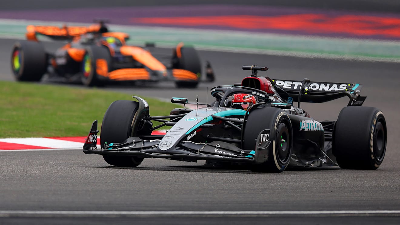SHANGHAI, CHINA - APRIL 21: George Russell of Great Britain driving the (63) Mercedes AMG Petronas F1 Team W15 leads Oscar Piastri of Australia driving the (81) McLaren MCL38 Mercedes on track during the F1 Grand Prix of China at Shanghai International Circuit on April 21, 2024 in Shanghai, China. (Photo by Lintao Zhang/Getty Images )
