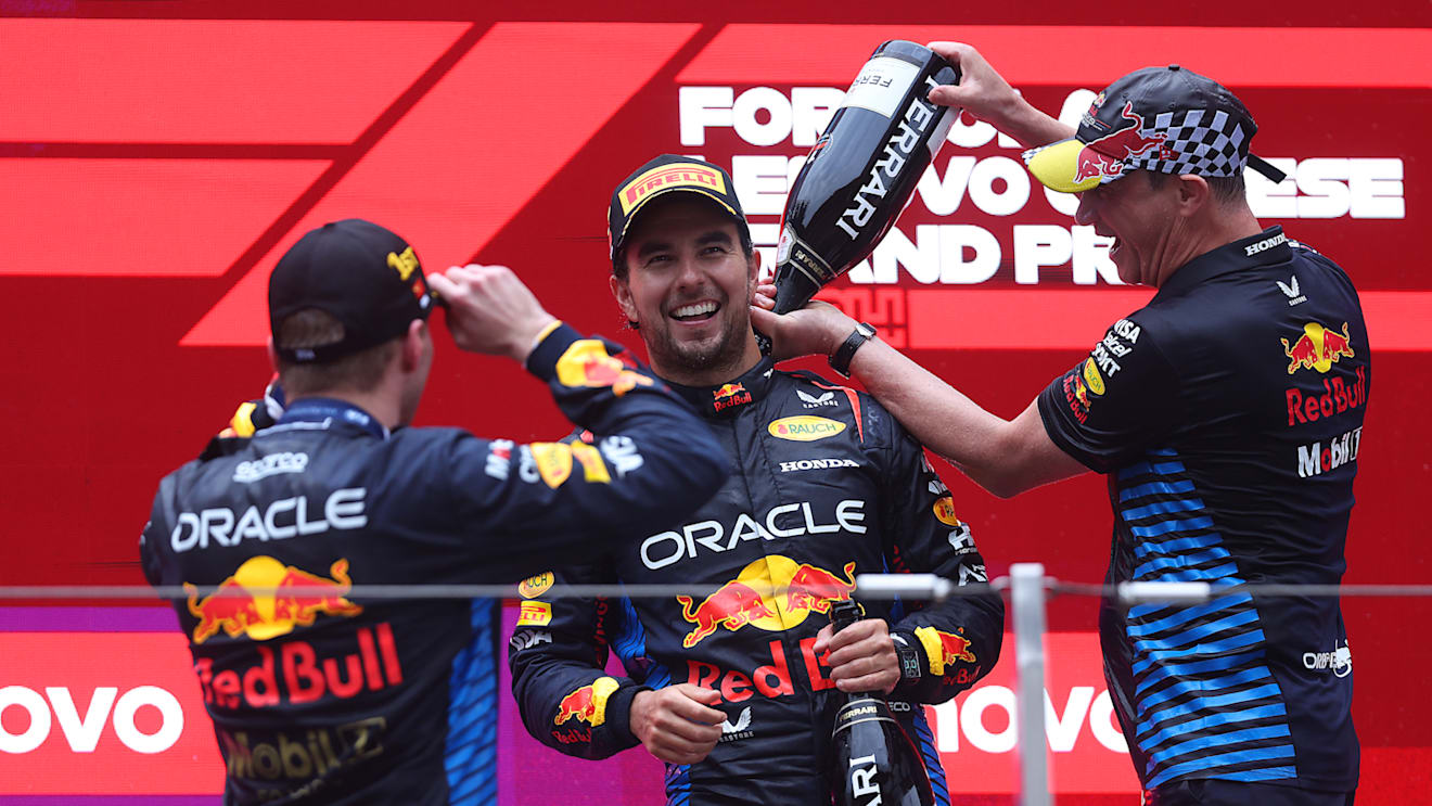 SHANGHAI, CHINA - APRIL 21: Race winner Max Verstappen of the Netherlands and Oracle Red Bull Racing, Third placed Sergio Perez of Mexico and Oracle Red Bull Racing and Oracle Red Bull Racing Head of Car Engineering Paul Monaghan celebrate on the podium during the F1 Grand Prix of China at Shanghai International Circuit on April 21, 2024 in Shanghai, China. (Photo by Lars Baron/Getty Images)