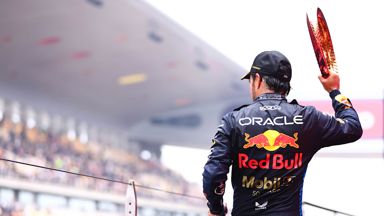 SHANGHAI, CHINA - APRIL 21: Third placed Sergio Perez of Mexico and Oracle Red Bull Racing celebrates with trophy on the podium after the F1 Grand Prix of China at Shanghai International Circuit on April 21, 2024 in Shanghai, China. (Photo by Bryn Lennon - Formula 1/Formula 1 via Getty Images)