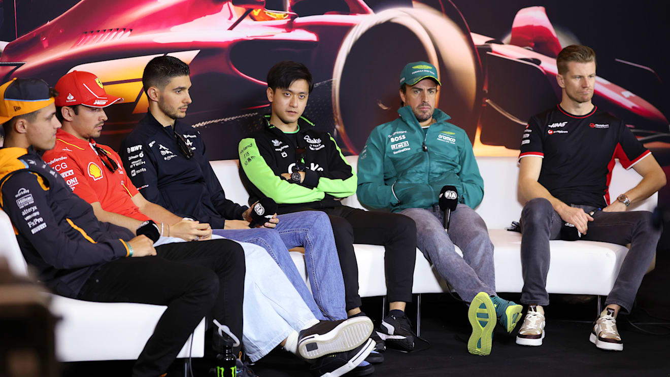SHANGHAI, CHINA - APRIL 18: Lando Norris of Great Britain and McLaren, Charles Leclerc of Monaco and Ferrari, Esteban Ocon of France and Alpine F1, Zhou Guanyu of China and Stake F1 Team Kick Sauber, Fernando Alonso of Spain and Aston Martin F1 Team and Nico Hulkenberg of Germany and Haas F1 attend the Drivers Press Conference during previews ahead of the F1 Grand Prix of China at Shanghai International Circuit on April 18, 2024 in Shanghai, China. (Photo by Lintao Zhang/Getty Images )