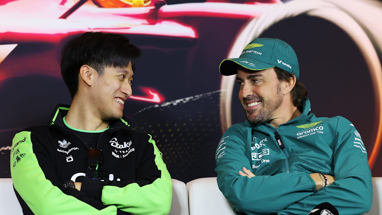SHANGHAI, CHINA - APRIL 18: Zhou Guanyu of China and Stake F1 Team Kick Sauber and Fernando Alonso of Spain and Aston Martin F1 Team talk in the Drivers Press Conference during previews ahead of the F1 Grand Prix of China at Shanghai International Circuit on April 18, 2024 in Shanghai, China. (Photo by Lintao Zhang/Getty Images )