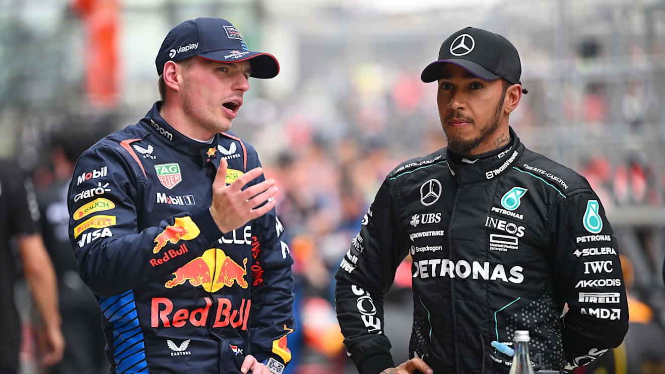SHANGHAI, CHINA - APRIL 20: Sprint winner Max Verstappen of the Netherlands and Oracle Red Bull Racing and Second placed Lewis Hamilton of Great Britain and Mercedes look on in parc ferme during the Sprint ahead of the F1 Grand Prix of China at Shanghai International Circuit on April 20, 2024 in Shanghai, China. (Photo by Clive Mason - Formula 1/Formula 1 via Getty Images)