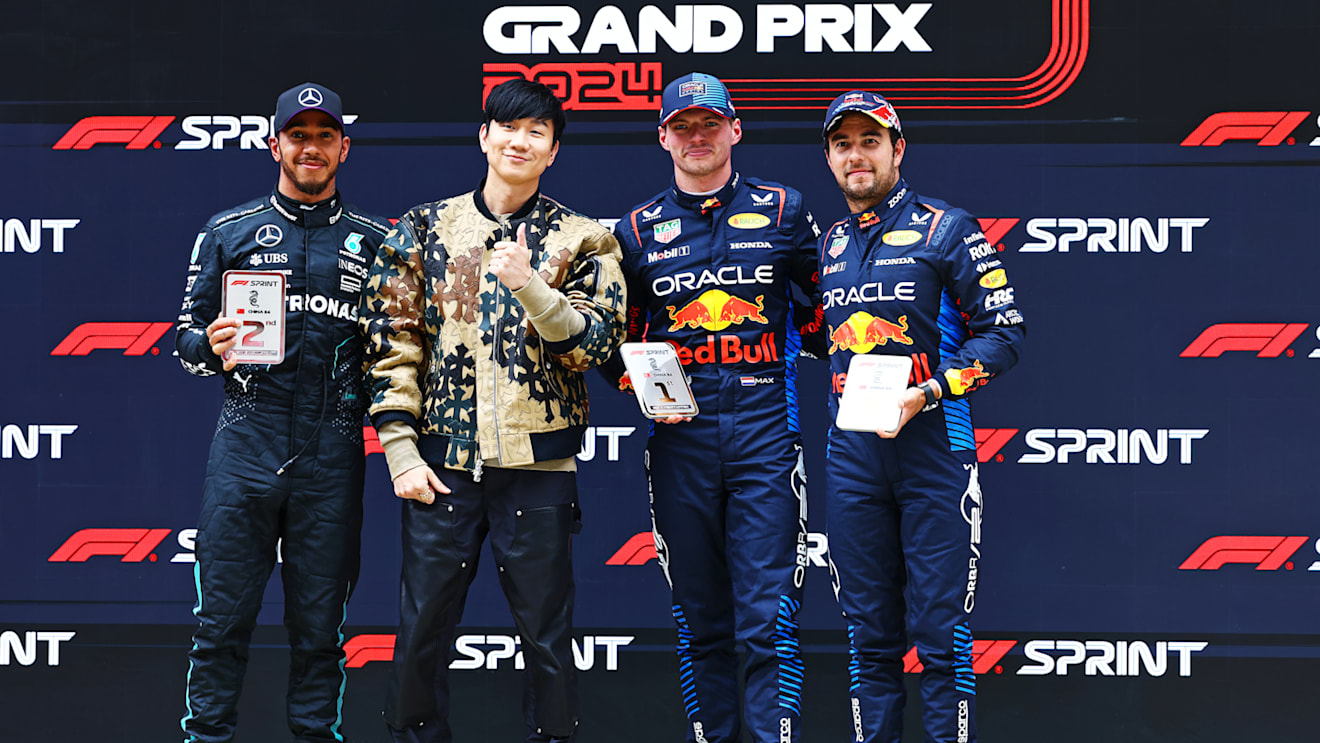 SHANGHAI, CHINA - APRIL 20: Sprint winner Max Verstappen of the Netherlands and Oracle Red Bull Racing, Second placed Lewis Hamilton of Great Britain and Mercedes, Third placed Sergio Perez of Mexico and Oracle Red Bull Racing and JJ Lin celebrate in parc ferme during the Sprint ahead of the F1 Grand Prix of China at Shanghai International Circuit on April 20, 2024 in Shanghai, China. (Photo by Mark Thompson/Getty Images)