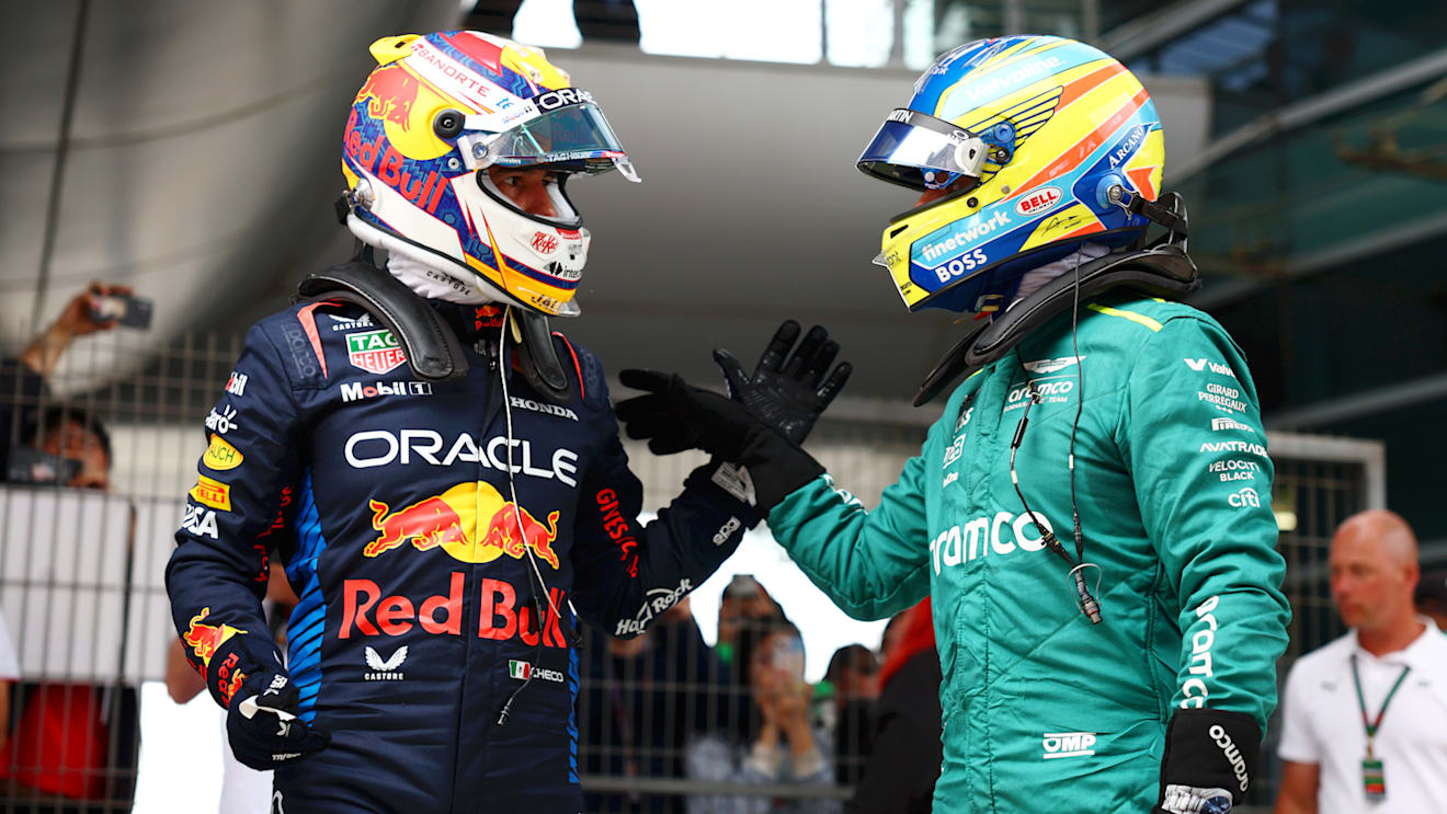 SHANGHAI, CHINA - APRIL 20: Second placed qualifier Sergio Perez of Mexico and Oracle Red Bull Racing and Third placed qualifier Fernando Alonso of Spain and Aston Martin F1 Team celebrate in parc ferme after qualifying ahead of the F1 Grand Prix of China at Shanghai International Circuit on April 20, 2024 in Shanghai, China. (Photo by Bryn Lennon - Formula 1/Formula 1 via Getty Images)