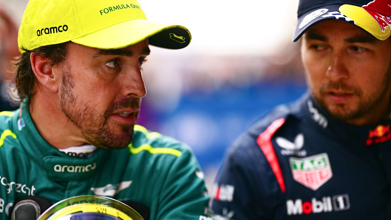 SHANGHAI, CHINA - APRIL 20: Third placed qualifier Fernando Alonso of Spain and Aston Martin F1 Team and Second placed qualifier Sergio Perez of Mexico and Oracle Red Bull Racing talk in parc ferme after qualifying ahead of the F1 Grand Prix of China at Shanghai International Circuit on April 20, 2024 in Shanghai, China. (Photo by Mario Renzi - Formula 1/Formula 1 via Getty Images)
