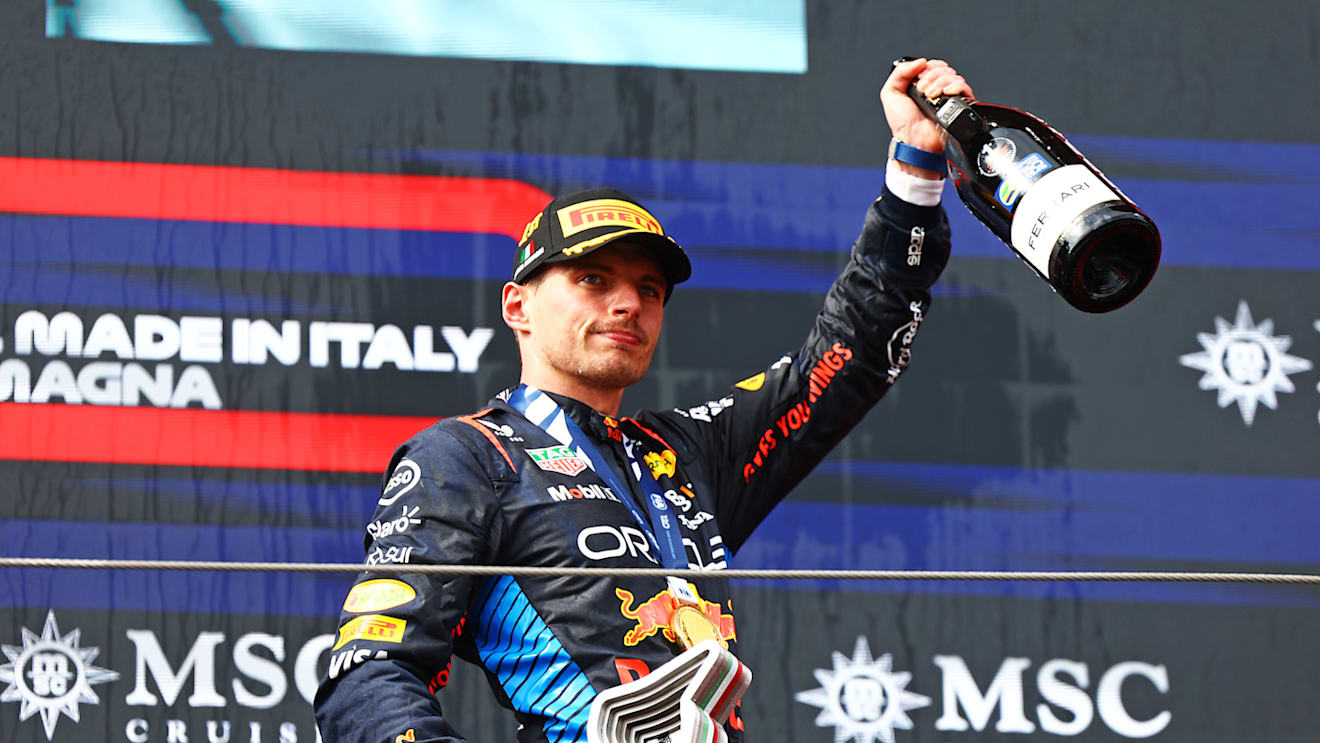 IMOLA, ITALY - MAY 19: Race winner Max Verstappen of the Netherlands and Oracle Red Bull Racing celebrates on the podium during the F1 Grand Prix of Emilia-Romagna at Autodromo Enzo e Dino Ferrari Circuit on May 19, 2024 in Imola, Italy. (Photo by Mark Thompson/Getty Images)