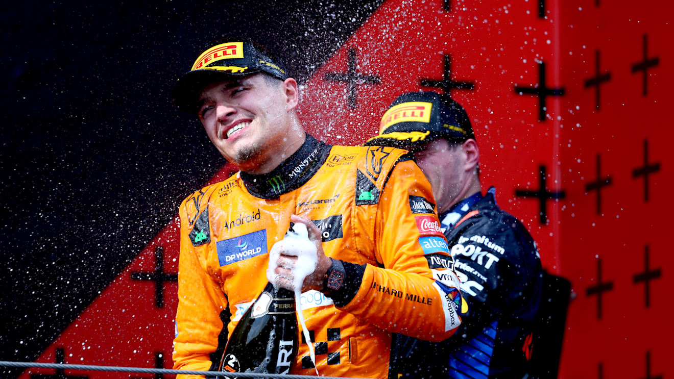 IMOLA, ITALY - MAY 19: Second placed Lando Norris of Great Britain and McLaren celebrates on the podium during the F1 Grand Prix of Emilia-Romagna at Autodromo Enzo e Dino Ferrari Circuit on May 19, 2024 in Imola, Italy. (Photo by Clive Rose/Getty Images)