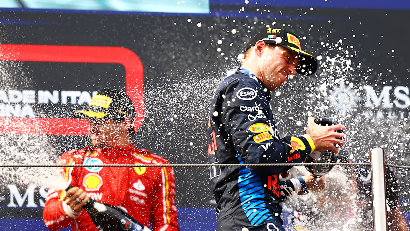IMOLA, ITALY - MAY 19: Race winner Max Verstappen of the Netherlands and Oracle Red Bull Racing celebrates on the podium during the F1 Grand Prix of Emilia-Romagna at Autodromo Enzo e Dino Ferrari Circuit on May 19, 2024 in Imola, Italy. (Photo by Mark Thompson/Getty Images)