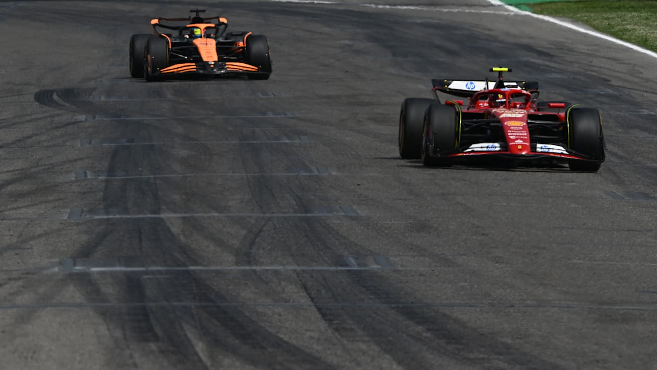 IMOLA, ITALY - MAY 19: Carlos Sainz of Spain driving (55) the Ferrari SF-24 leads Oscar Piastri of Australia driving the (81) McLaren MCL38 Mercedes during the F1 Grand Prix of Emilia-Romagna at Autodromo Enzo e Dino Ferrari Circuit on May 19, 2024 in Imola, Italy. (Photo by Rudy Carezzevoli/Getty Images)