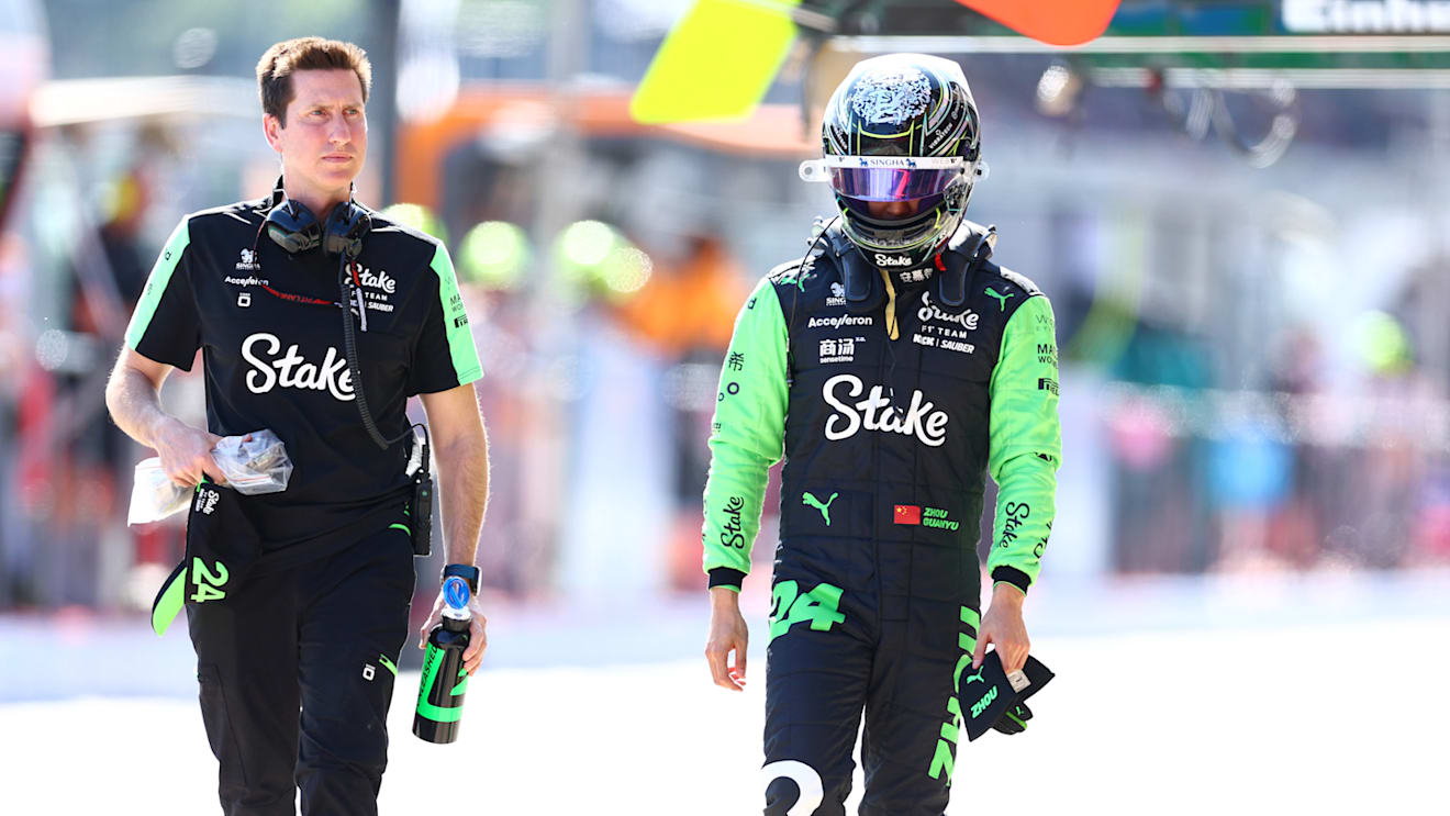 IMOLA, ITALY - MAY 18: 17th placed qualifier Zhou Guanyu of China and Stake F1 Team Kick Sauber walks in the Pitlane during qualifying ahead of the F1 Grand Prix of Emilia-Romagna at Autodromo Enzo e Dino Ferrari Circuit on May 18, 2024 in Imola, Italy. (Photo by Bryn Lennon - Formula 1/Formula 1 via Getty Images)