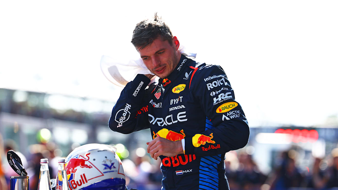 IMOLA, ITALY - MAY 18: Pole position qualifier Max Verstappen of the Netherlands and Oracle Red Bull Racing wipes his head with a towel in parc ferme during qualifying ahead of the F1 Grand Prix of Emilia-Romagna at Autodromo Enzo e Dino Ferrari Circuit on May 18, 2024 in Imola, Italy. (Photo by Mark Thompson/Getty Images)