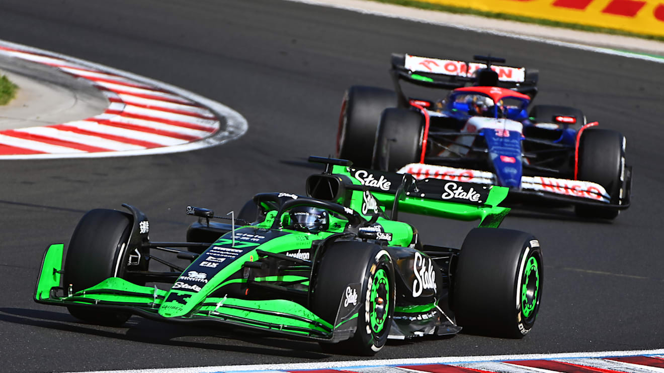 BUDAPEST, HUNGARY - JULY 21: Valtteri Bottas of Finland driving the (77) Kick Sauber C44 Ferrari leads Daniel Ricciardo of Australia driving the (3) Visa Cash App RB VCARB 01 on track during the F1 Grand Prix of Hungary at Hungaroring on July 21, 2024 in Budapest, Hungary. (Photo by James Sutton - Formula 1/Formula 1 via Getty Images)