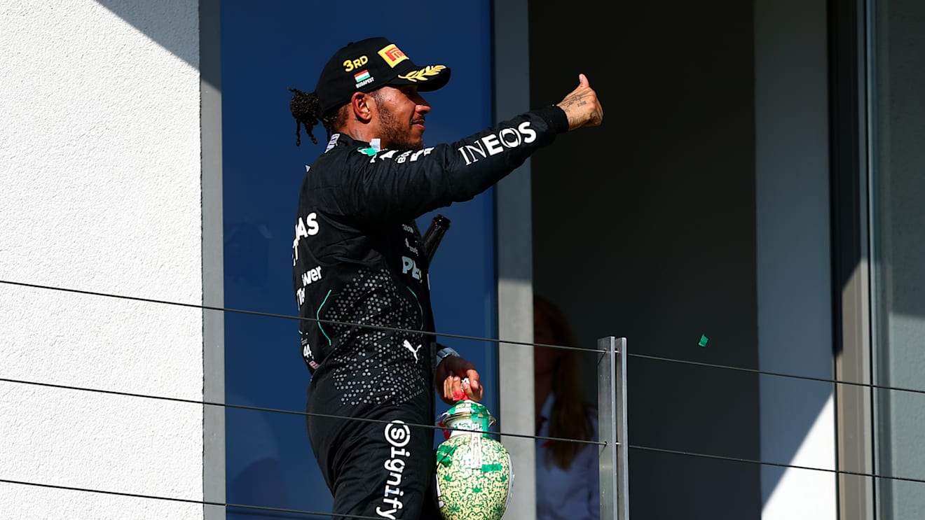 BUDAPEST, HUNGARY - JULY 21: Third placed Lewis Hamilton of Great Britain and Mercedes celebrates on the podium during the F1 Grand Prix of Hungary at Hungaroring on July 21, 2024 in Budapest, Hungary. (Photo by Joe Portlock - Formula 1/Formula 1 via Getty Images)