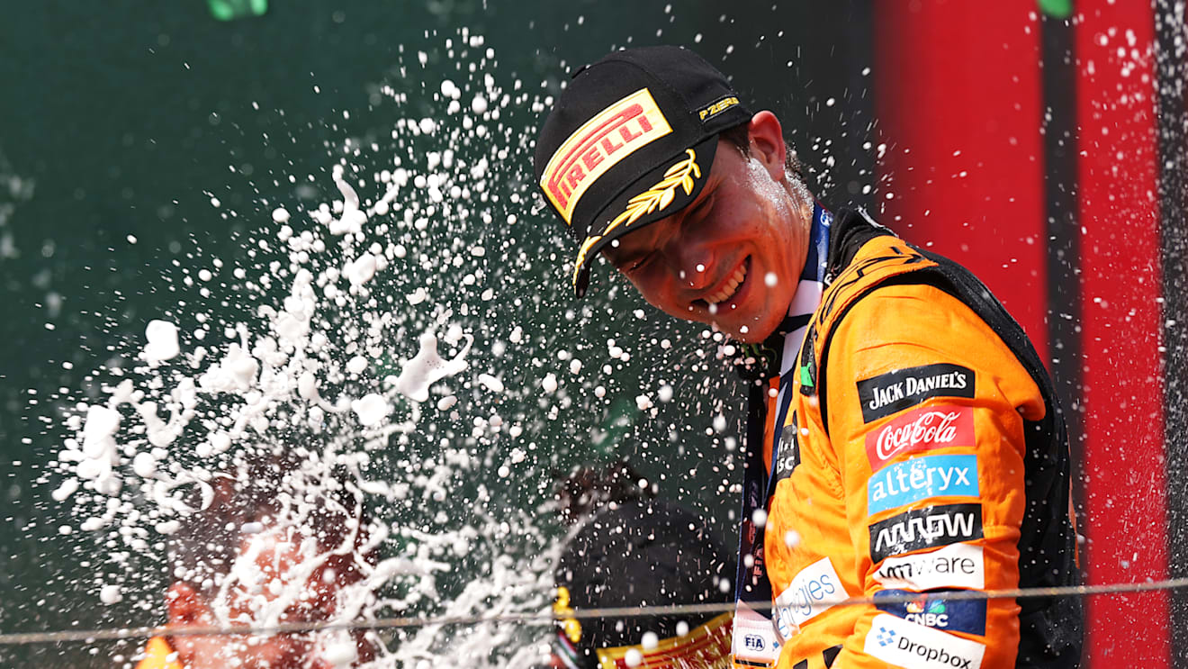 BUDAPEST, HUNGARY - JULY 21: Race winner Oscar Piastri of Australia and McLaren celebrates his maiden race win on the podium during the F1 Grand Prix of Hungary at Hungaroring on July 21, 2024 in Budapest, Hungary. (Photo by Dean Mouhtaropoulos/Getty Images)