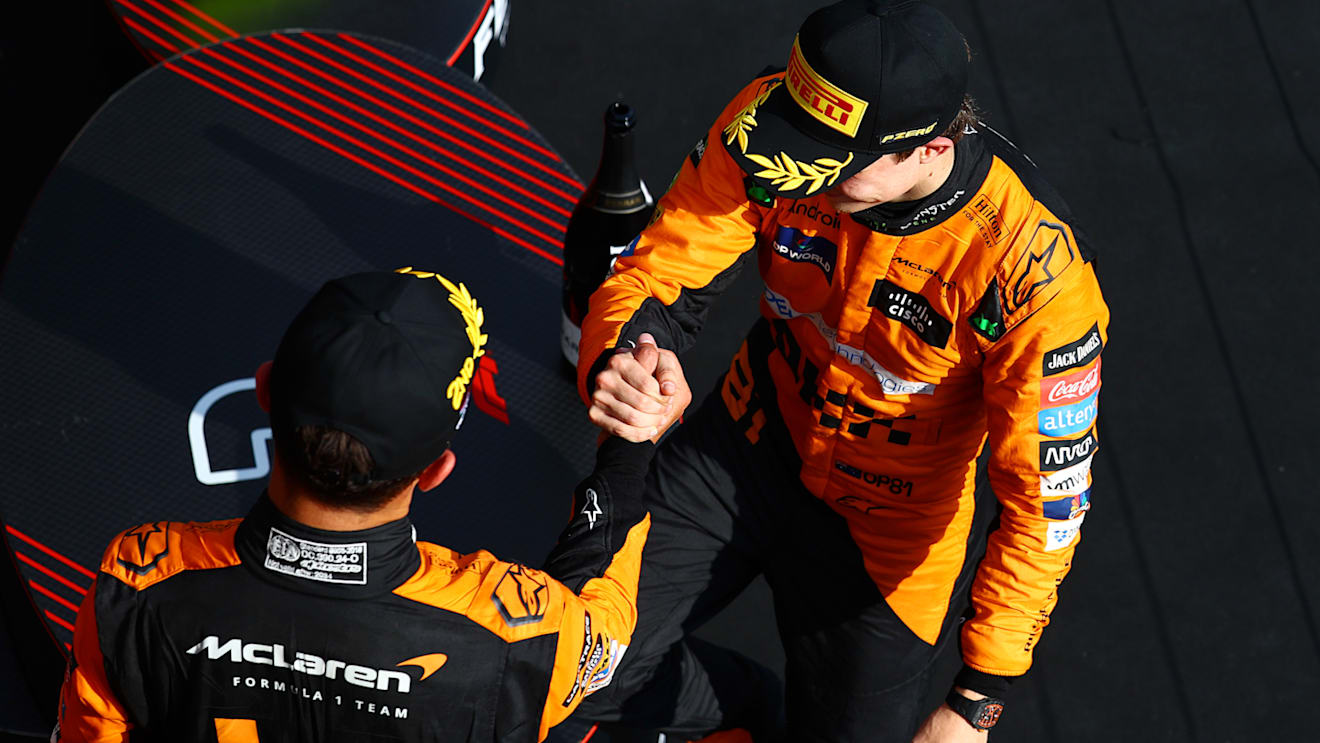 BUDAPEST, HUNGARY - JULY 21: Race winner Oscar Piastri of Australia and McLaren and Second placed Lando Norris of Great Britain and McLaren celebrate on the podium during the F1 Grand Prix of Hungary at Hungaroring on July 21, 2024 in Budapest, Hungary. (Photo by Mark Thompson/Getty Images)
