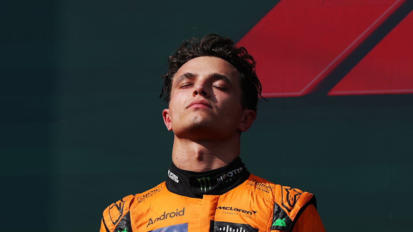 BUDAPEST, HUNGARY - JULY 21: Second placed Lando Norris of Great Britain and McLaren stands on the podium during the F1 Grand Prix of Hungary at Hungaroring on July 21, 2024 in Budapest, Hungary. (Photo by Dean Mouhtaropoulos/Getty Images)