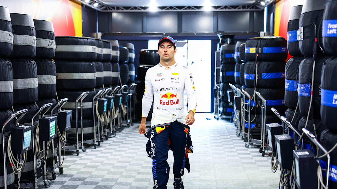 BUDAPEST, HUNGARY - JULY 20: Sergio Perez of Mexico and Oracle Red Bull Racing walks into the garage during qualifying ahead of the F1 Grand Prix of Hungary at Hungaroring on July 20, 2024 in Budapest, Hungary. (Photo by Mark Thompson/Getty Images)